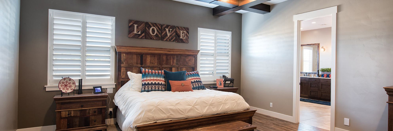 Craftsman polywood shutters in a large bedroom.